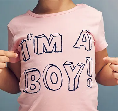 Pink t-shirt reading "I'M A BOY!
